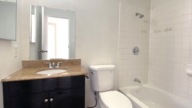 Building Photo - Great 3 bedroom and 1.5 bath townhouse with a small yard and 2 car garage.