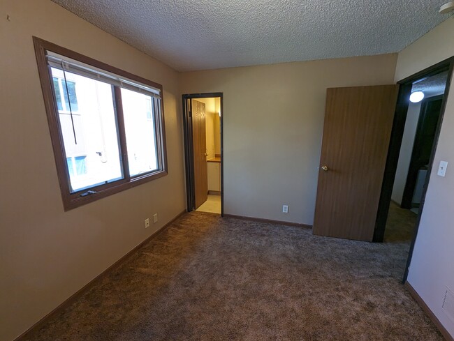 Master bedroom - door to master bathroom - 4945 Walker Ave