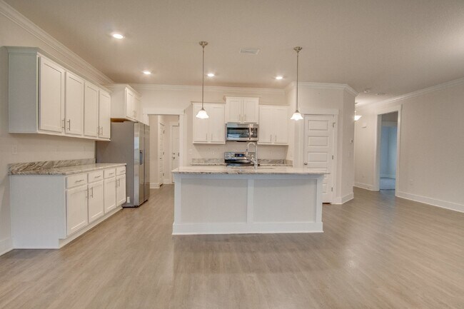 Building Photo - Spacious Cantonment Townhome with Open Layout, 2-Car Garage, Covered Back Porch & Easy Access to ...