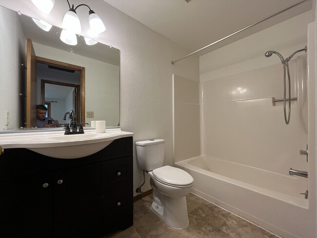 Building Photo - Spacious 3-Bedroom Home with Custom Stone Fireplace, Attached 2-Car Garage & Expansive Backyard i...