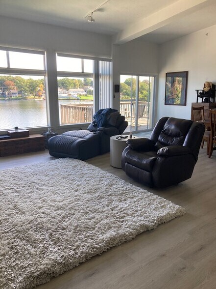 Living room with new flooring - 231 Lake Ave