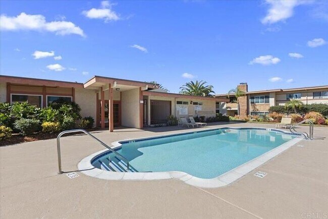 Building Photo - Poolside Living at Its Finest – Turnkey 3BR Condo with Direct Patio Access to the Pool