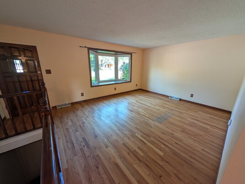 living room with bay window - 28 James Circle