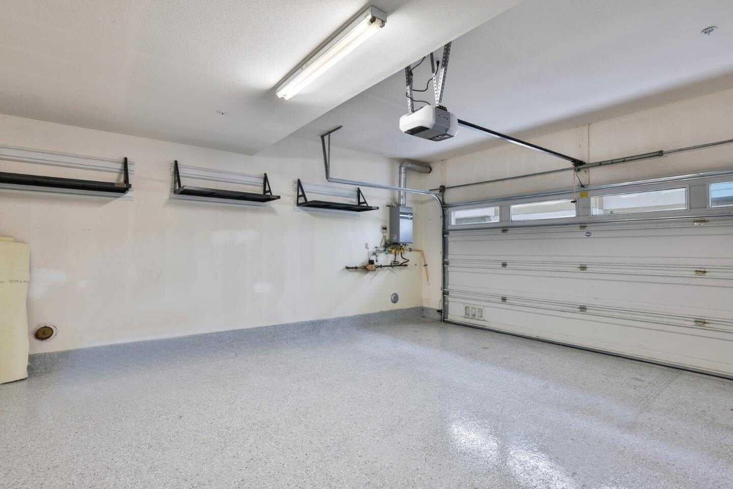 Garage with Storage Racks and Tankless Water Heater - 1310 Nestwood Way