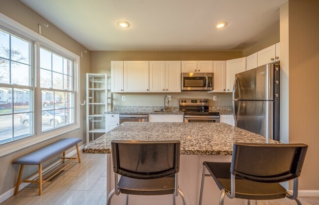 Building Photo - Spacious 3-Level Townhouse with Finished Basement and Fenced Patio