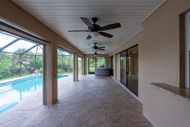 Building Photo - 3 BEDROOM • 2 BATHROOM • PRIVATE POOL • WATERFRONT • BOAT LIFT • ZERO DEPOSIT MOVE-IN AVAILABLE