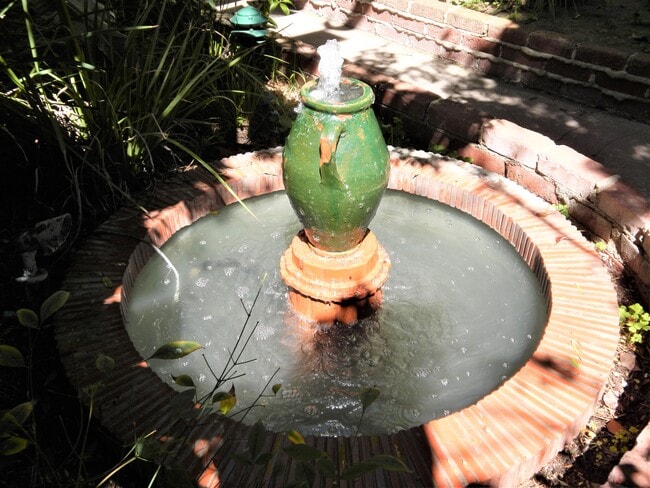 courtyard fountain - 1235 N Sweetzer Ave