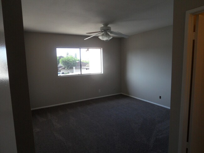 Building Photo - Two Story 4 BR 2.5 BA Condo With 2 Car Garage