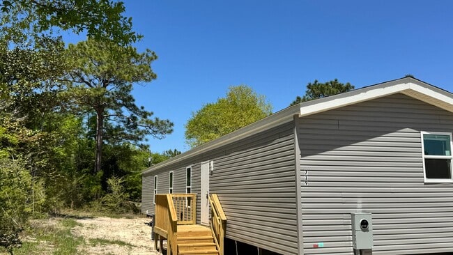 Building Photo - SPECTACULAR WATER-VIEW W/ LARGE DECK BRAND...