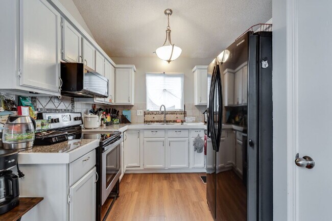 Building Photo - "Spacious 4-Bedroom Gem with 3 Full Baths ...