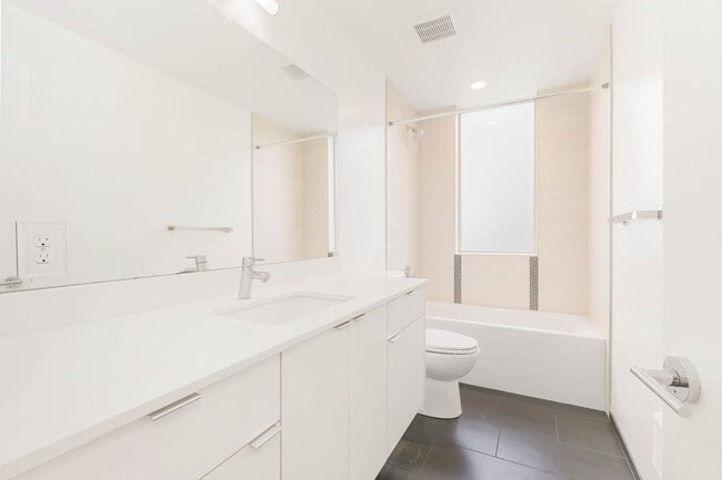 Building Photo - 3 Bedroom Modern Industrial Townhome with City Views & Rooftop Oasis