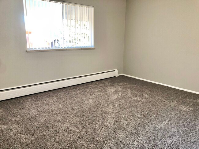 Embrace the comfort of a bright and airy bedroom, perfect for relaxation. - GRACE LANDINGS APARTMENTS