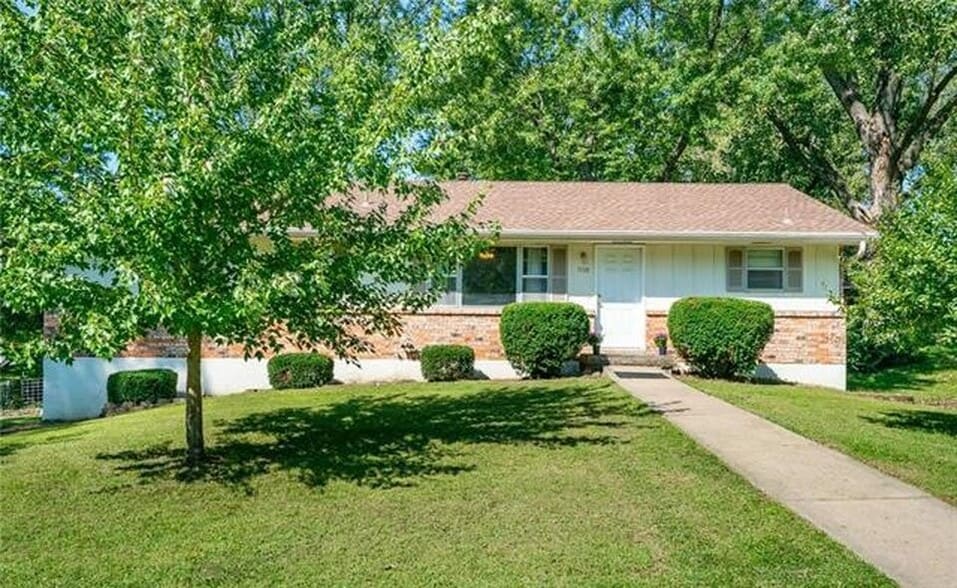 Front entrance, surrounded by beautiful landscaping and mature trees. - 7416 N. Central St.