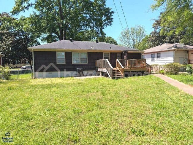 Building Photo - Updated Bungalow with Massive Deck and Fully Fenced Yard!