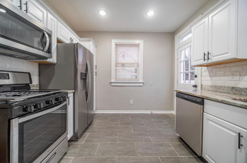 Kitchen with stainless steel appliances, granite countertops - 421 Zimpfer St