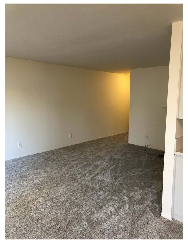 Living Room area in front of Fireplace area viewed from dining area - 12030 Rochester Ave