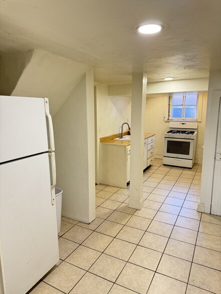 Kitchen with fridge and gas range - 145 E 300 S