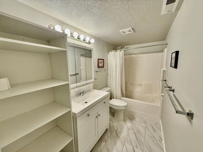 Building Photo - Furnished and Utilities Included: Two-Bedroom Basement Apartment with Private Yard