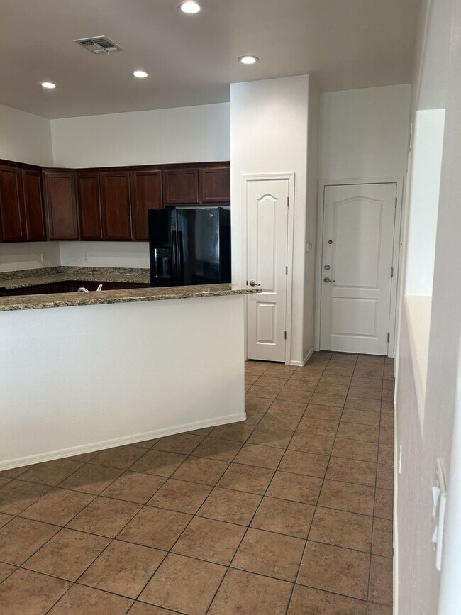 Building Photo - Unfurnished four bedroom large home!  Three car garage