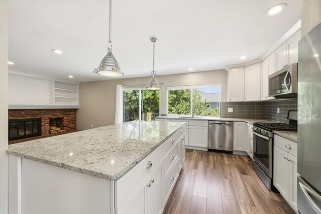 Building Photo - Spacious 4BR Home with Finished Basement, Private Yard & Community Amenities