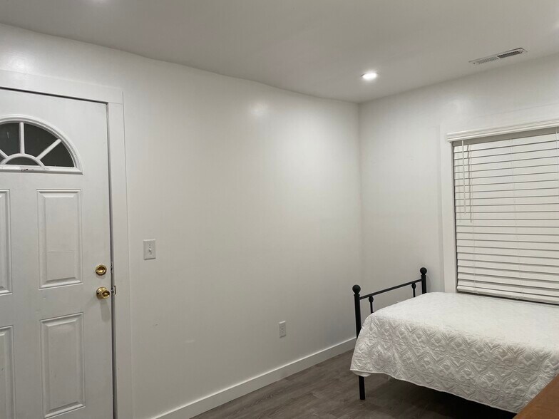 Secondary Bedroom with Access to Back Patio - 620 Simpson St
