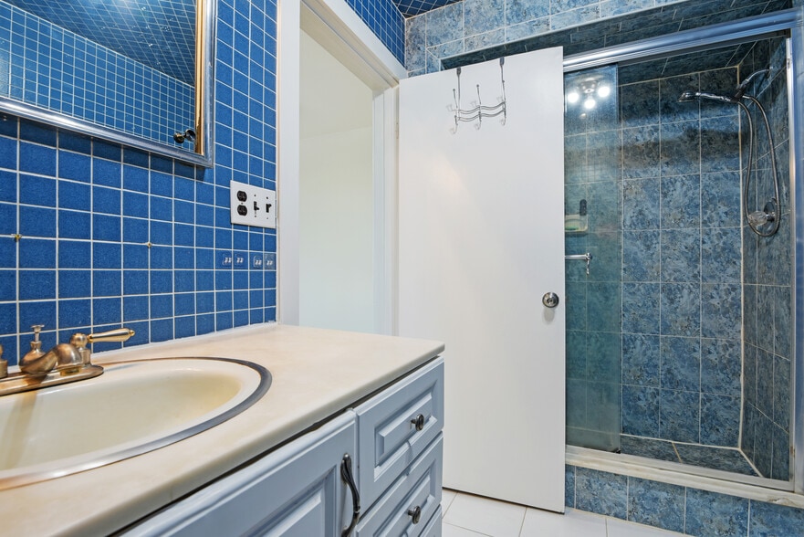 fully tiled bathroom - 1301 Rogers Rd