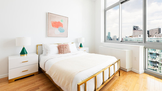 photo of 4615 Center Blvd model apartment master bedroom in daytime - 4615 Center Blvd