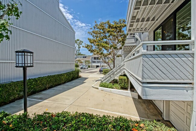 Building Photo - Remodeled, Bright & Airy End Unit Condo Overlooking Randall Preserve w/ Grand Entry Foyer, Open &...