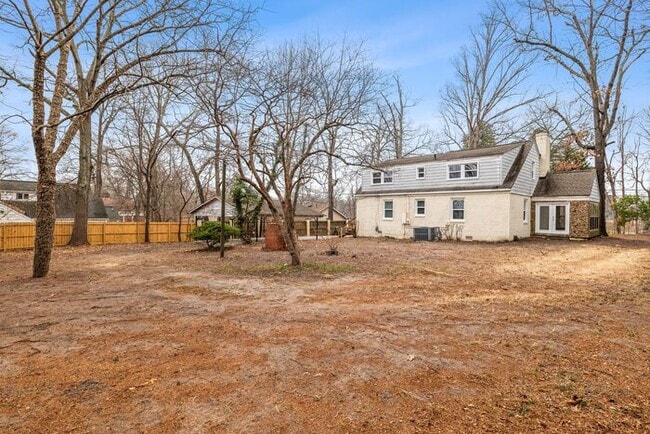 Building Photo - Brick home, Two Story, Hardwoods, DR, 2 Sun Rooms, FP, Carport!.