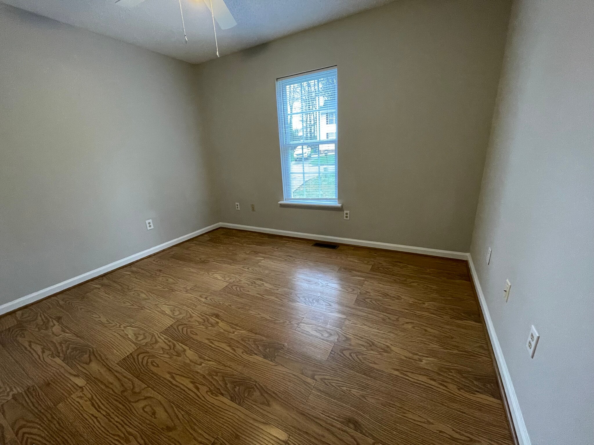 Bedroom 2 has a ceiling fan and overlooks the front yard - 4684 Coltsfoot Rd