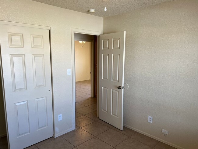 Building Photo - Four Bedroom Mountain View Home with large fenced back yard and double gates