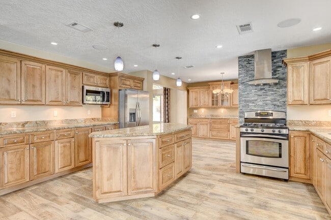 Building Photo - Gorgeous 4 Bedroom, 2 Story Home with a Beautiful Pool in the Lakes!