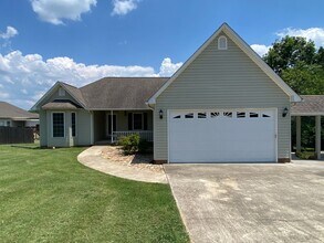 Building Photo - ***COMING SOON, JUNE 1ST*** 3 Bedroom 2 Bath house with attached garage, sun room, large back deck