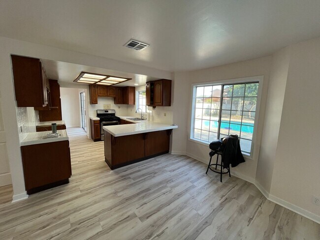 Building Photo - Reseda 4+3 w/fireplace, vaulted ceilings, new flooring, solar panels, + pool!