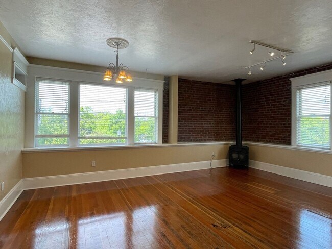 Building Photo - Urban DREAM! Spacious 1-Bedroom w/ Exposed Brick, Fireplace, & More in a Hip Location!
