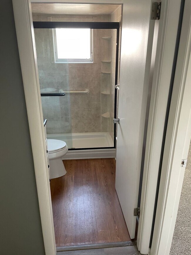 Building Photo - 55+ Charming first-floor condo nestled in ...