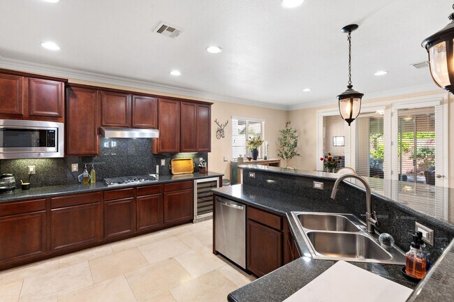 Building Photo - Spacious Mountain’s Edge Home with Den, Sunroom, 3-Car Garage & Private Spa Retreat