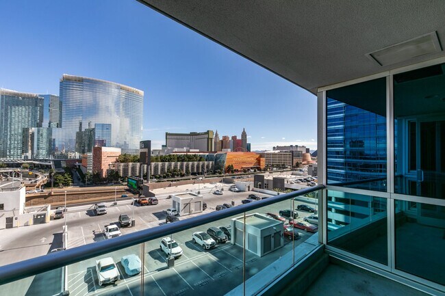Building Photo - Iconic Strip-View Luxury | Elegant 1BR + Den High-Rise Residence