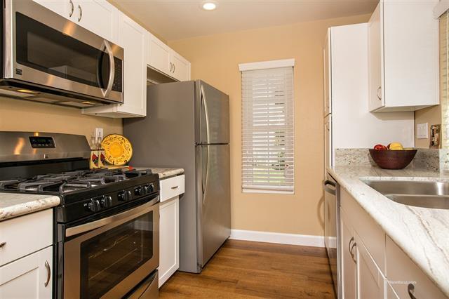 Updated kitchen with hardwood floors and granite counter tops. - 13327 Caminito Ciera #61