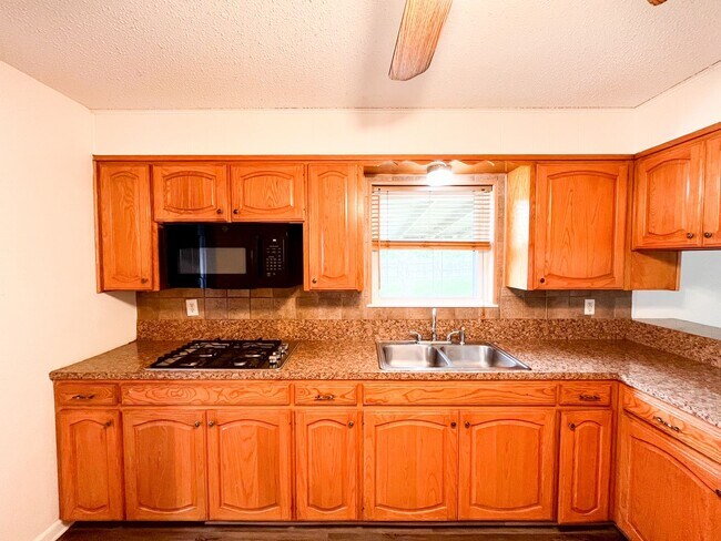 Building Photo - Available Now!!!! Gorgeous 3 bedroom, 2 bath, 2 car garage home. Beautiful wood look flooring. Sp...