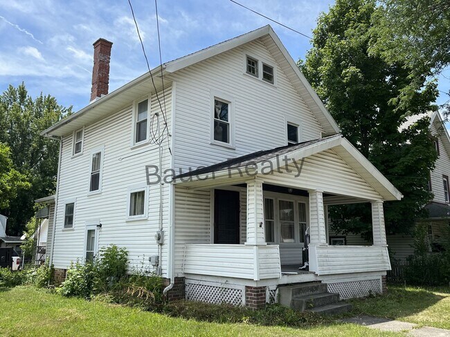 Building Photo - Three bedroom home with two car, detached garage!