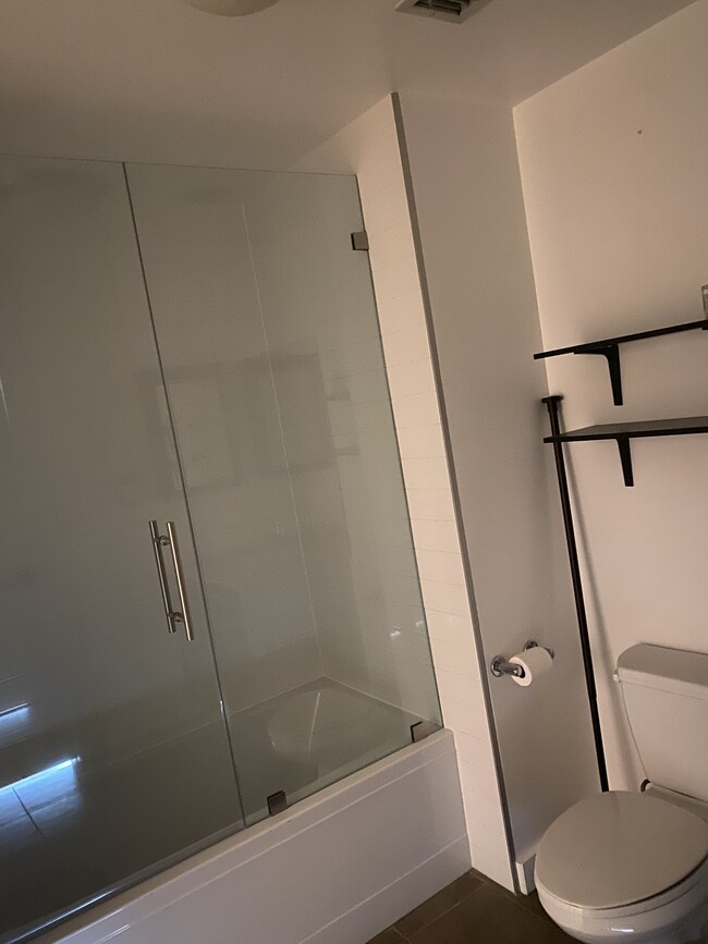 Tall glass shower doors - 645 W 9th St