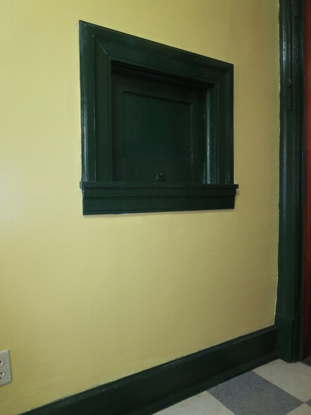 Kitchen: Door that opens into the back of the Dining Room cabinet. - 204 S 6th St