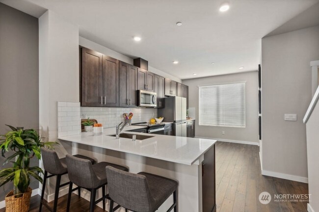 Building Photo - Modern Benton Square Townhome with Tandem 2-Car Garage + Flex Space