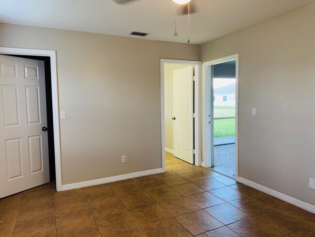 Building Photo - Experience this Cape Coral 3 bedroom 2 bath corner duplex with 1 car garage and screened in lanai.