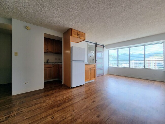 Building Photo - For Rent | Full Size Studio Apartment with...