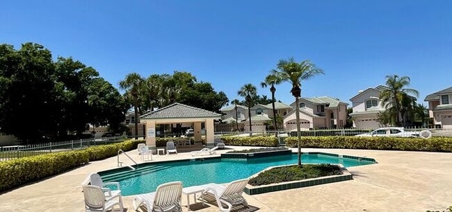 Building Photo - 3 Bedroom 2.5 Bath Cinnamon Bay Home with Stunning view, and Hardwood Flooring!