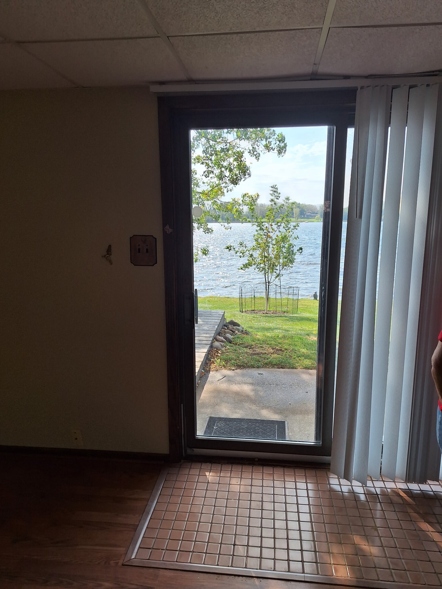 Picture from living room to entrance. - 9199 Jane Rd N