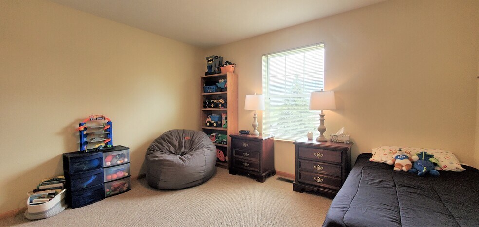 Bedroom 2/upper level. (photo from neighboring unit with the same layout) - 1756 St Joseph St