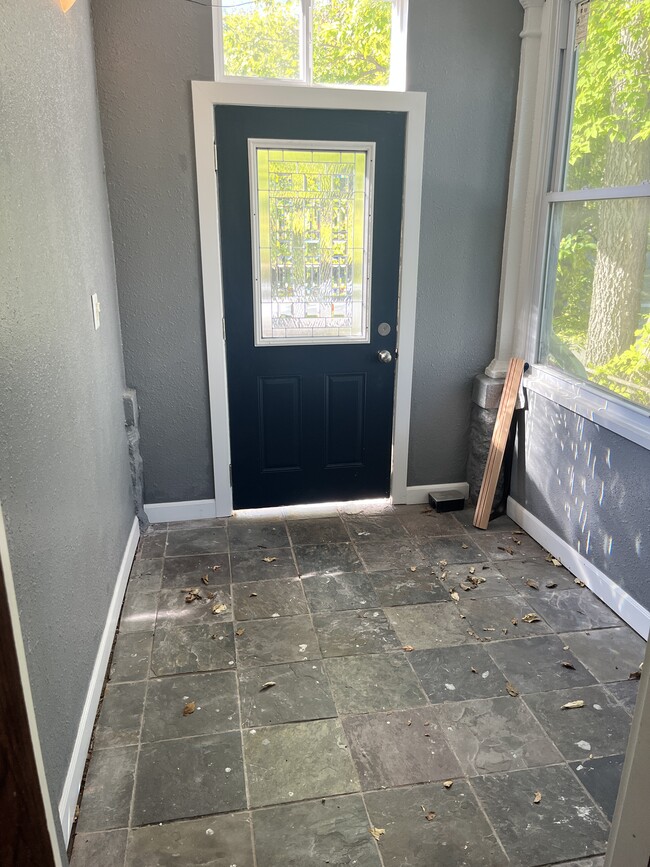 Front Porch door. This is always unlocked allowing deliveries to be placed in here. - 3517 19th Ave S